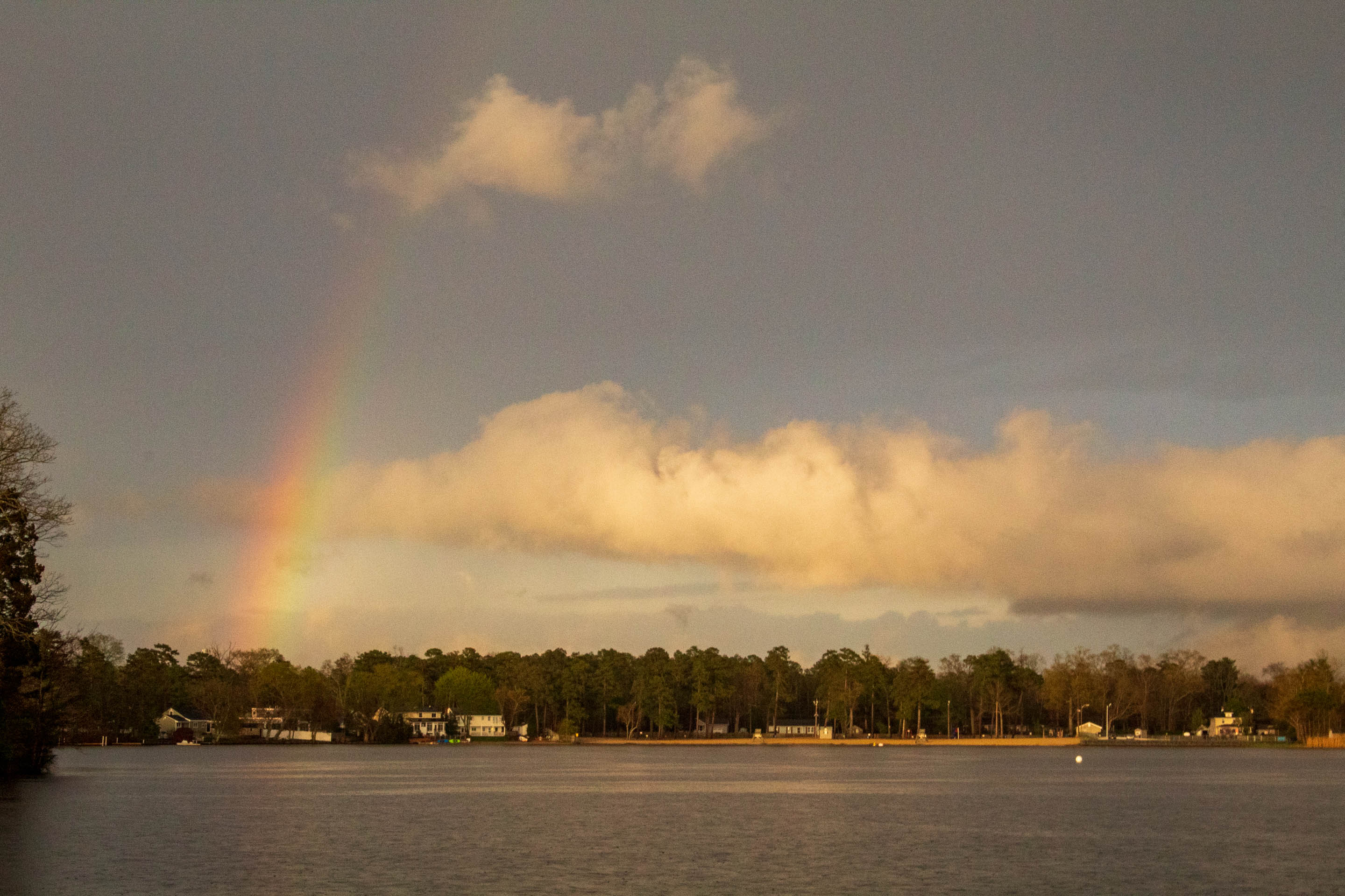 Photograph of a rainbow over a lake in Mays Landing, New Jersey